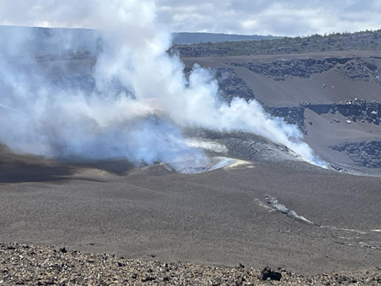 Color photograph of volcanic vents degassing