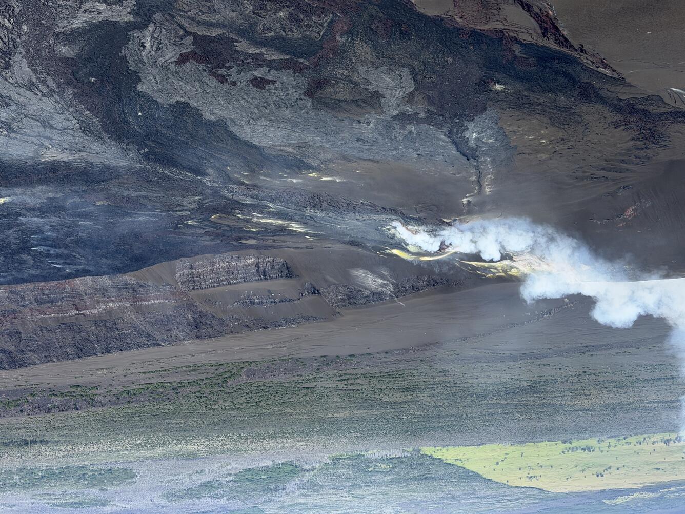 Color photograph of degassing volcanic vents