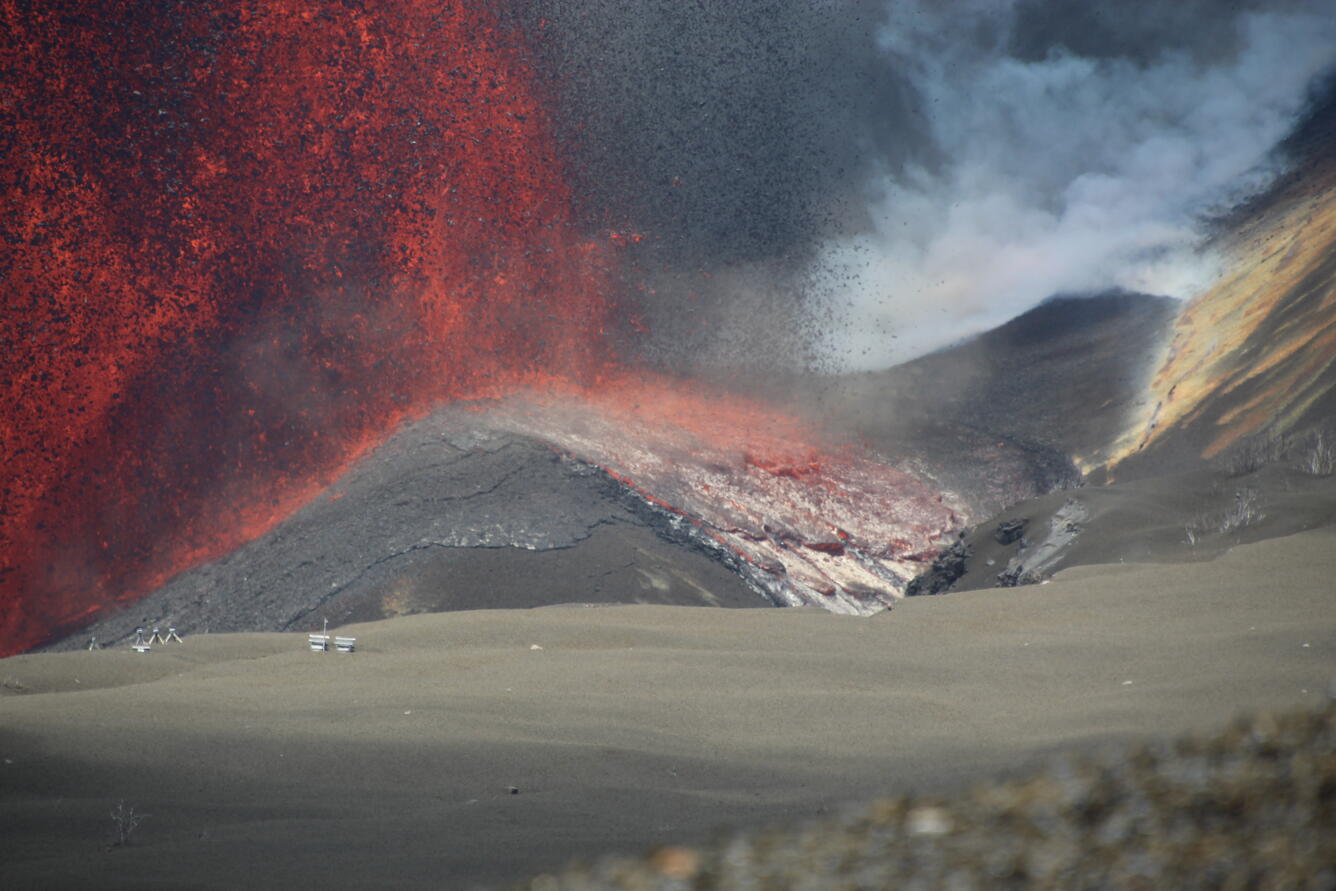 Color photograph of lava fountain base with lava flow