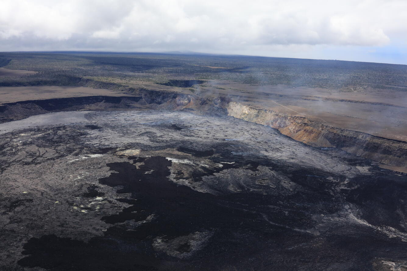 Color photograph of crater with lava flows in it