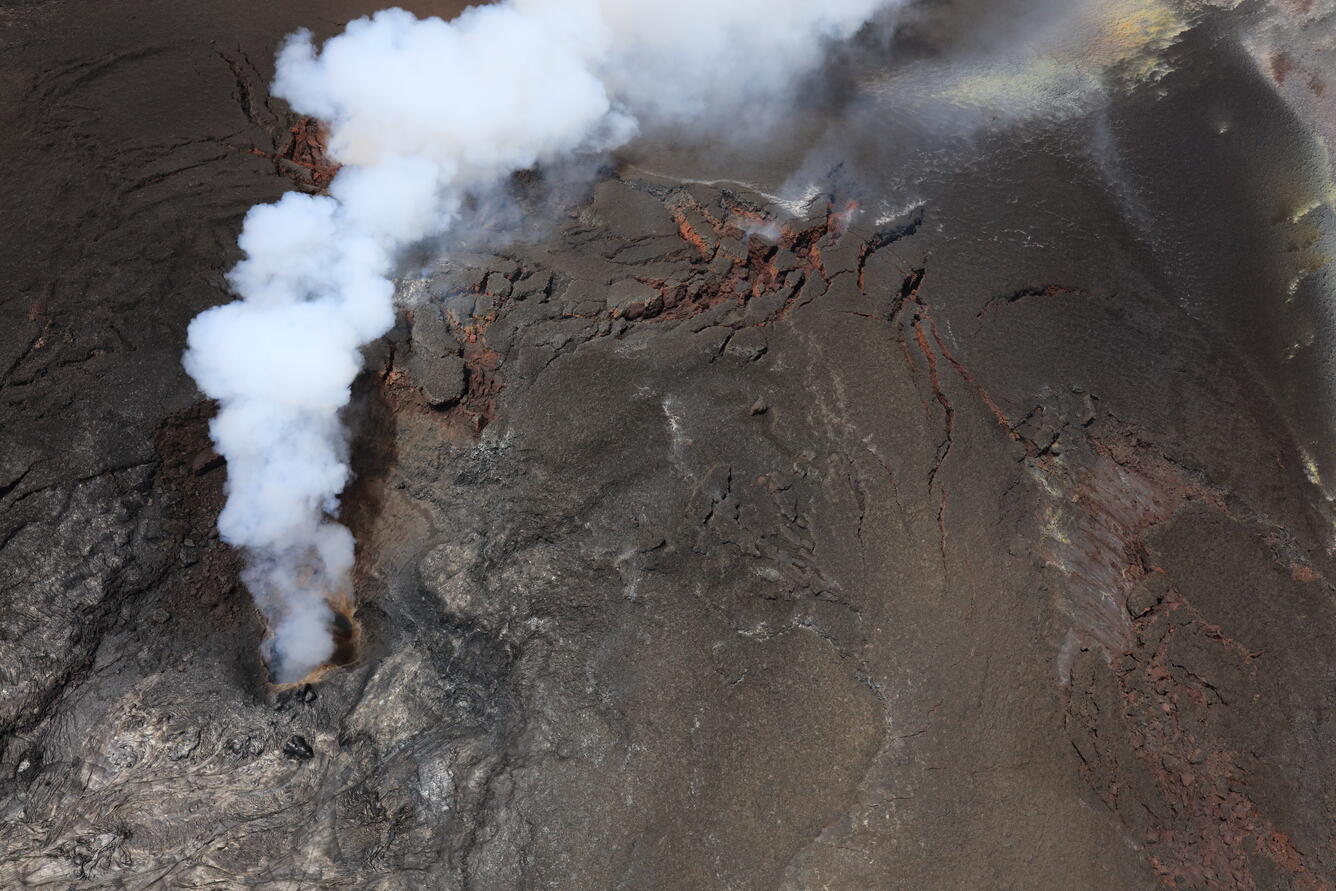 Color photograph of volcanic vent degassing