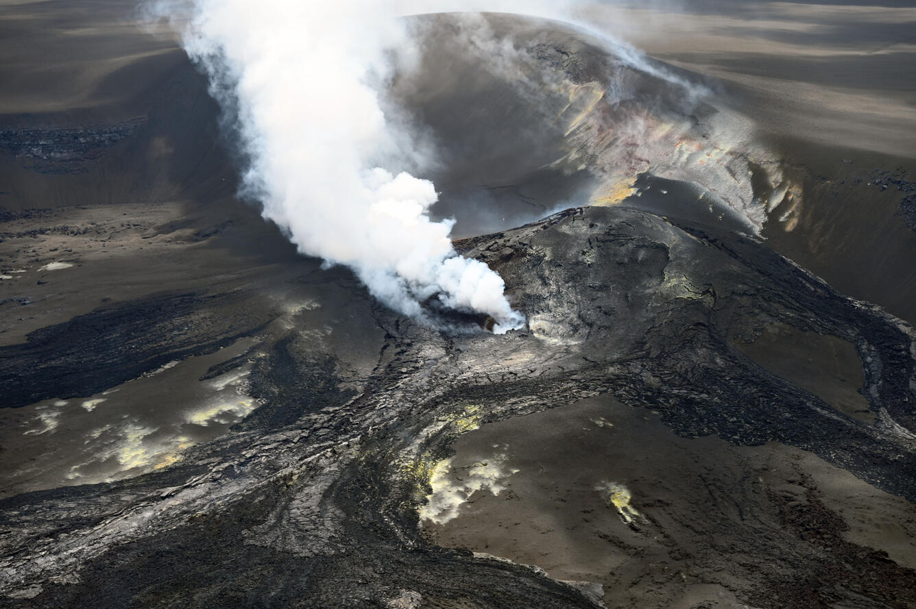 Color photograph of volcanic vents degassing