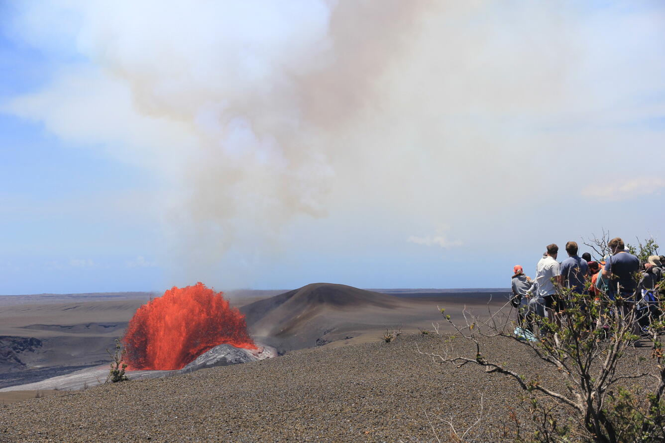 Color photograph of lava fountain and viewers