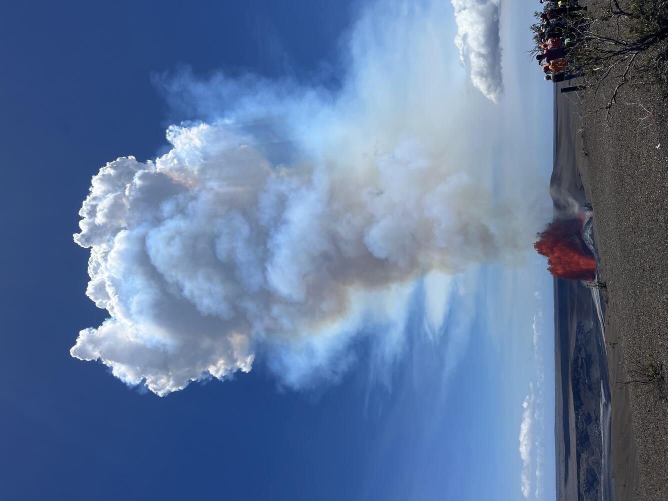 Color photograph of lava fountain and viewers