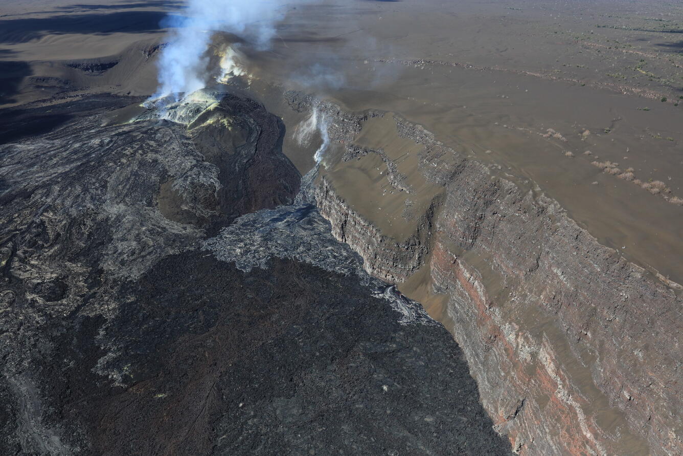 Color photograph of volcanic vents degassing