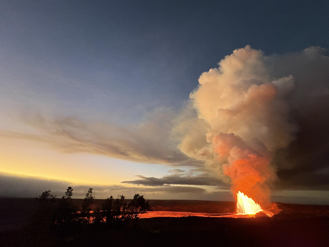Color photograph of lava fountain during sunrise