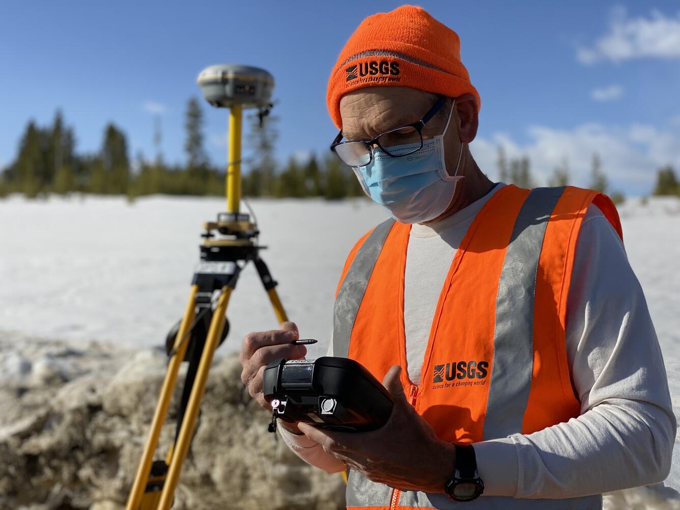 Joe Adams (NUSO) setting up a GPS base station for a snow mapping project in Winter Park, Colorado