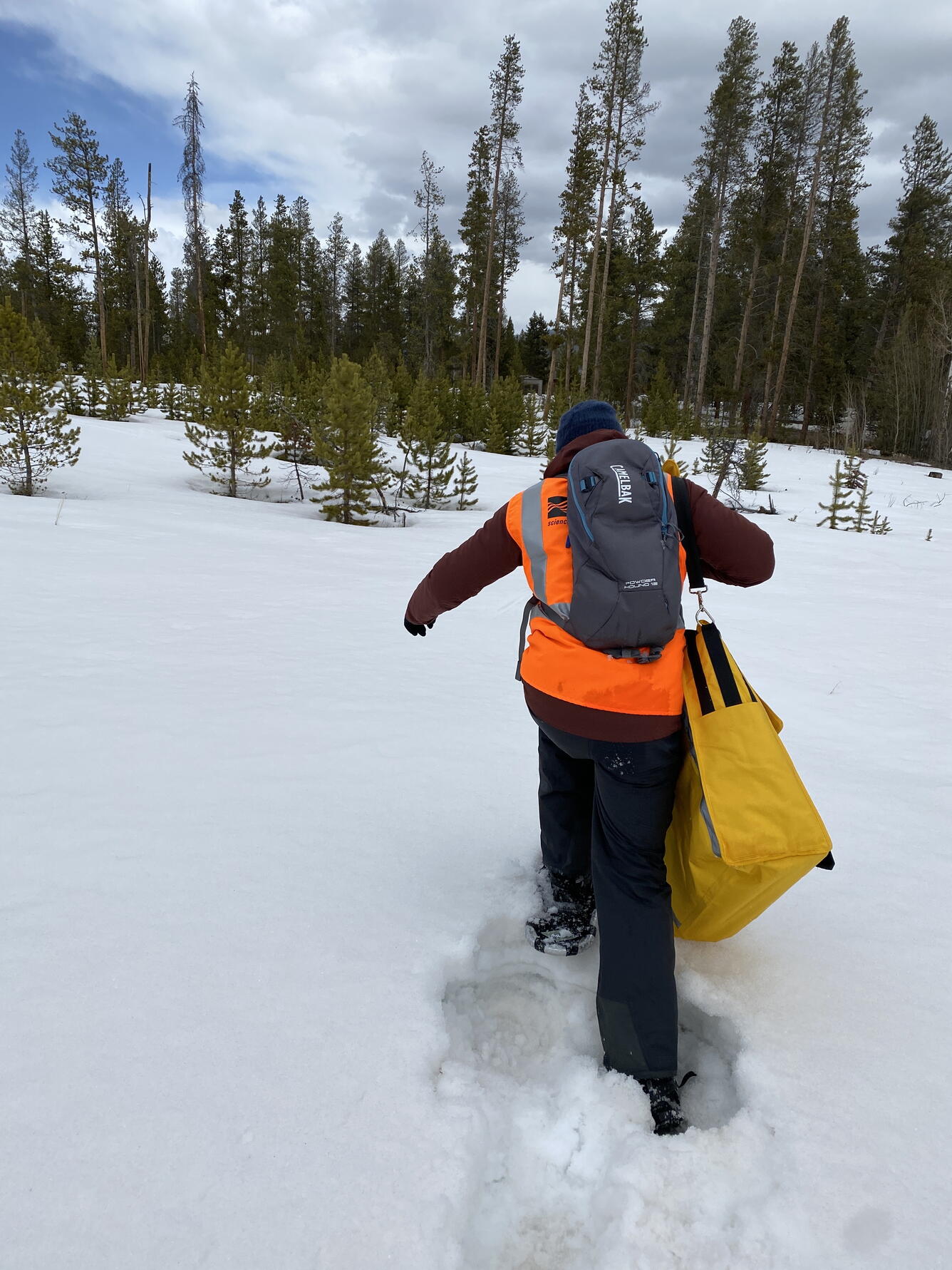 USGS scientist snowshoeing in Winter Park Colorado to place UAS ground control targets