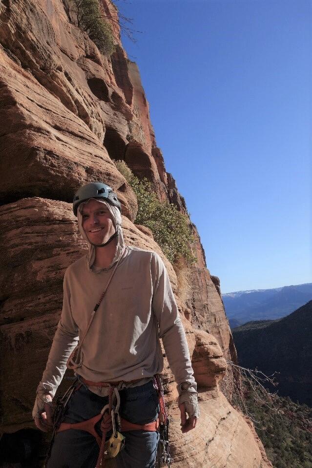 Staff profile picture of Patrick Longley climbing in Utah.