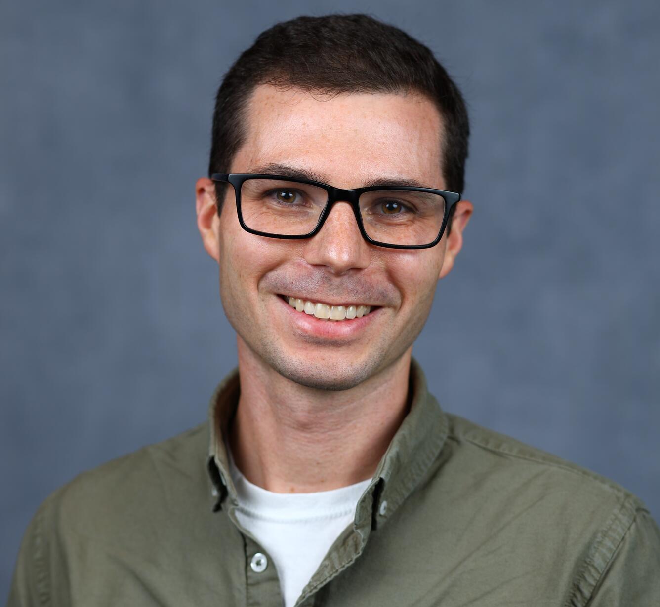 Photo of Phillip Goodling in glasses with a green shirt