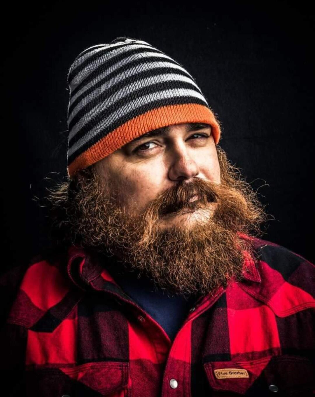 Headshot of Adam Ostman. 