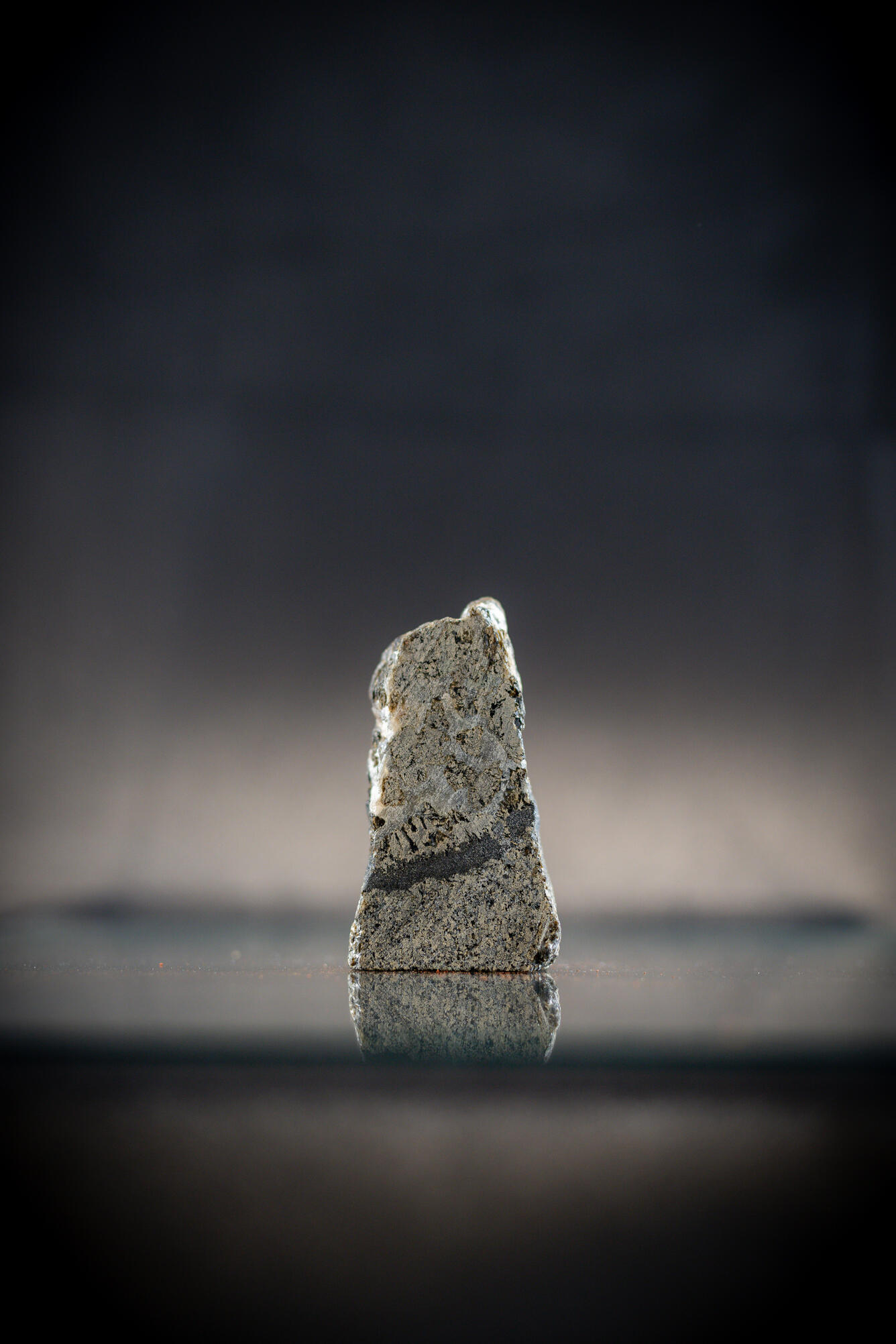 USGS mineral specimen showing chromite band in gabbro with platinum content.