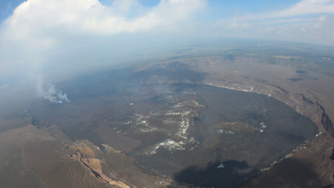 Color photograph of misty volcanic crater