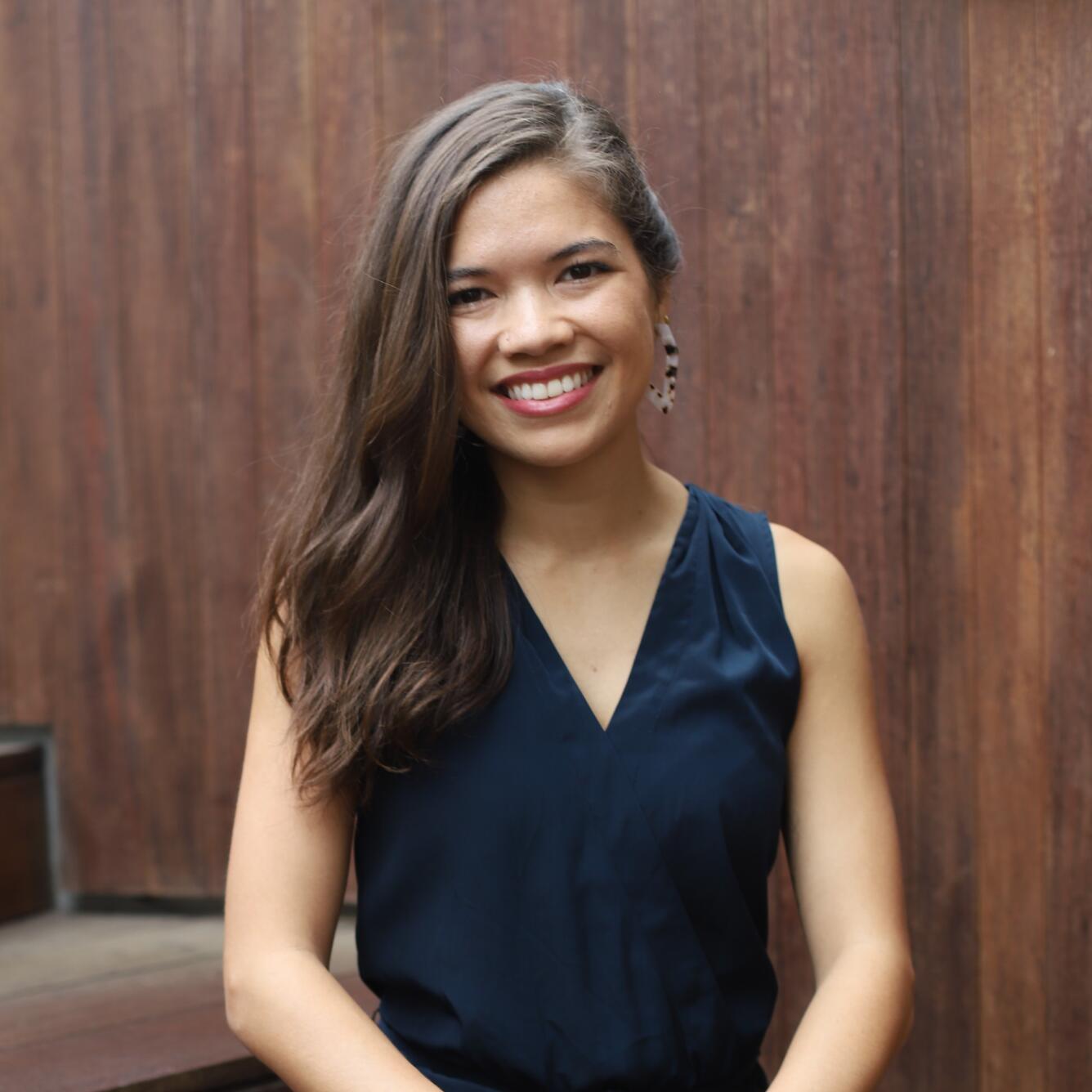 Photo of Sabine Loos standing in a black blouse