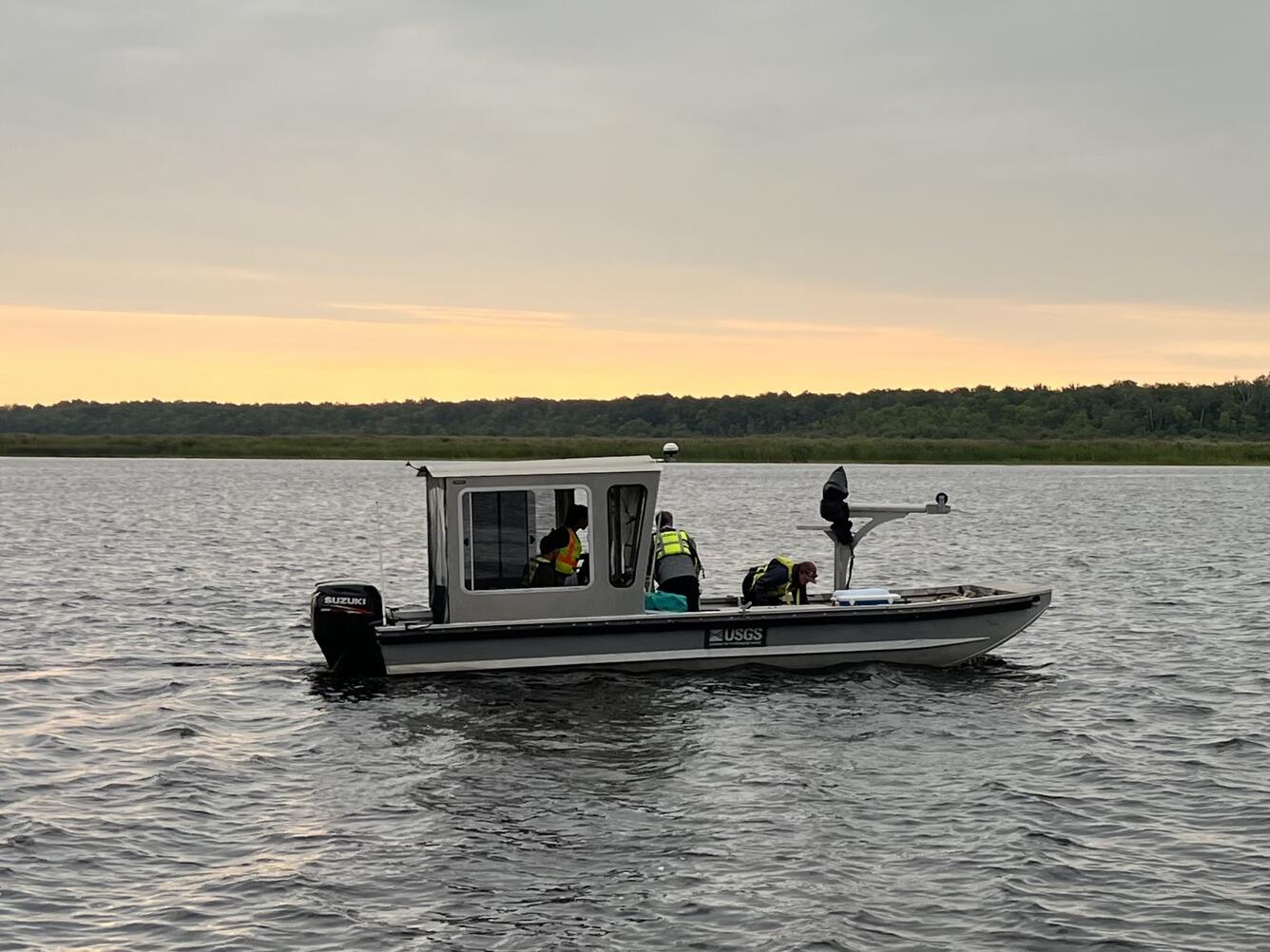 USGS research boat on river at dawn