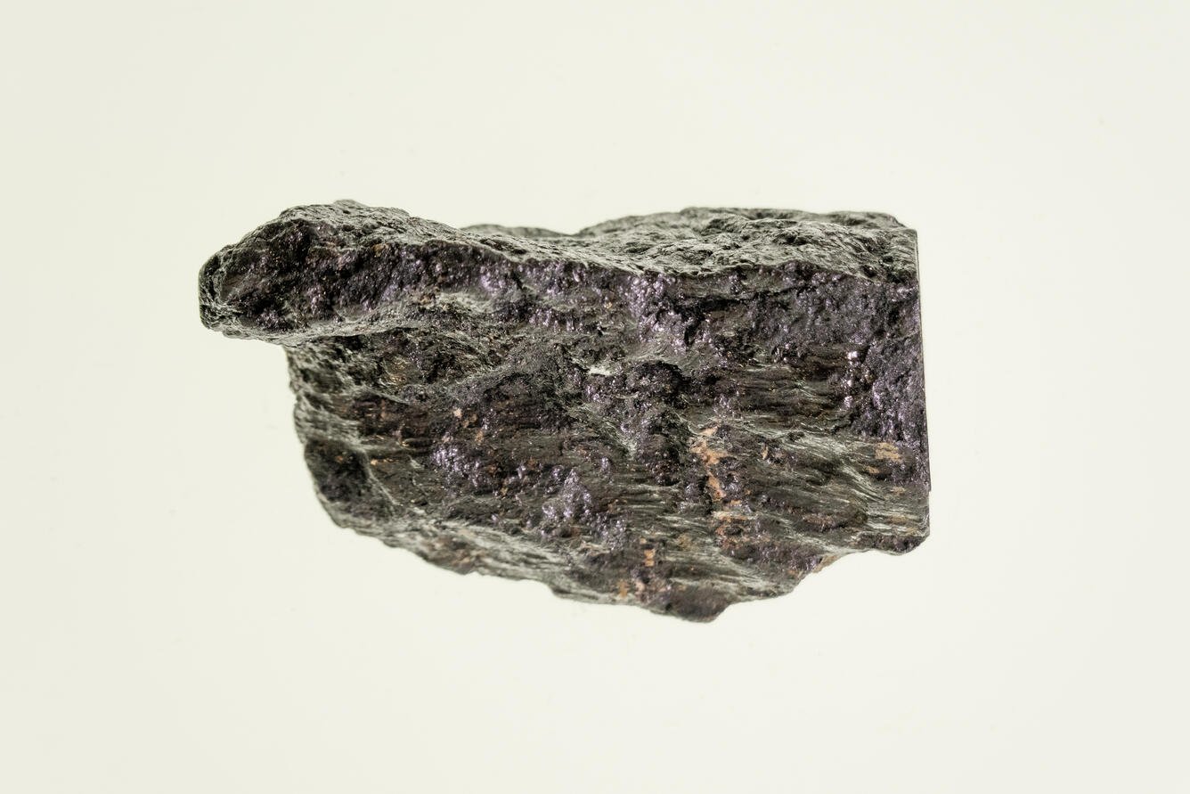 High-definition image of silver-bismuth ore specimen with dark matrix and metallic flecks.