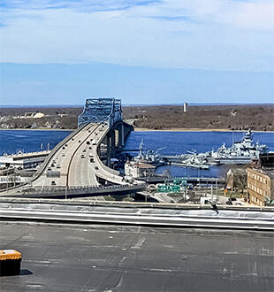 Right side of image: Sam Banas performing a calibration test of a precipitation tipping bucket instrument