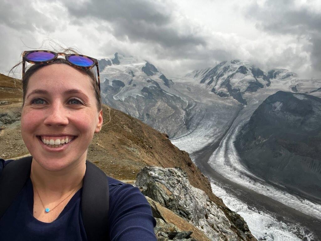 Woman's staff profile picture in the mounntains
