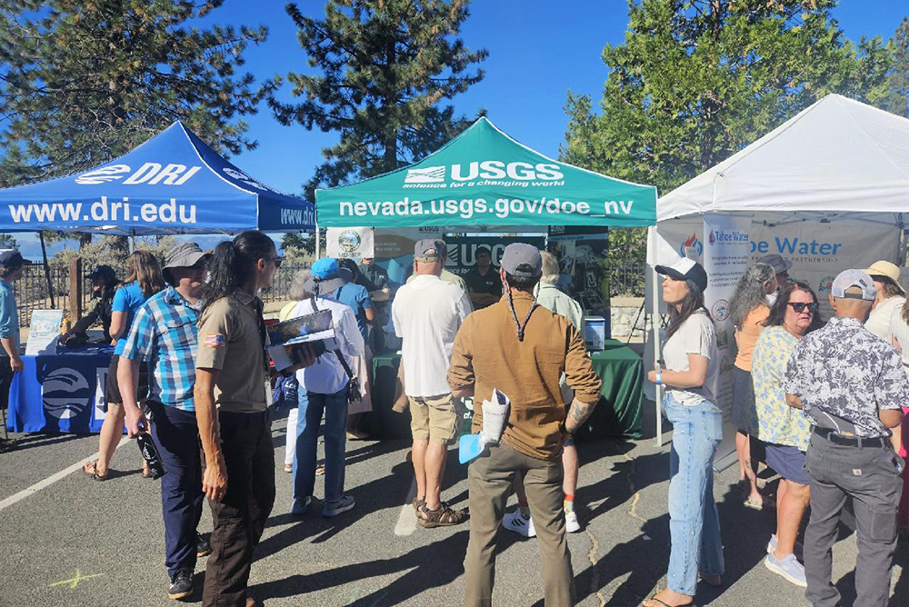 Attendees gather at the USGS booth at the 2026 Tahoe Summit