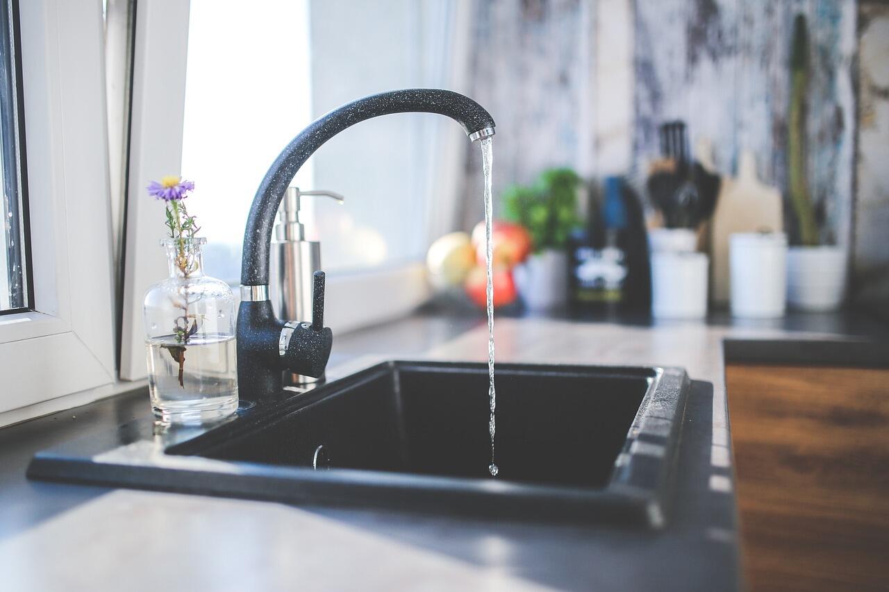 Image of kitchen sink with water running