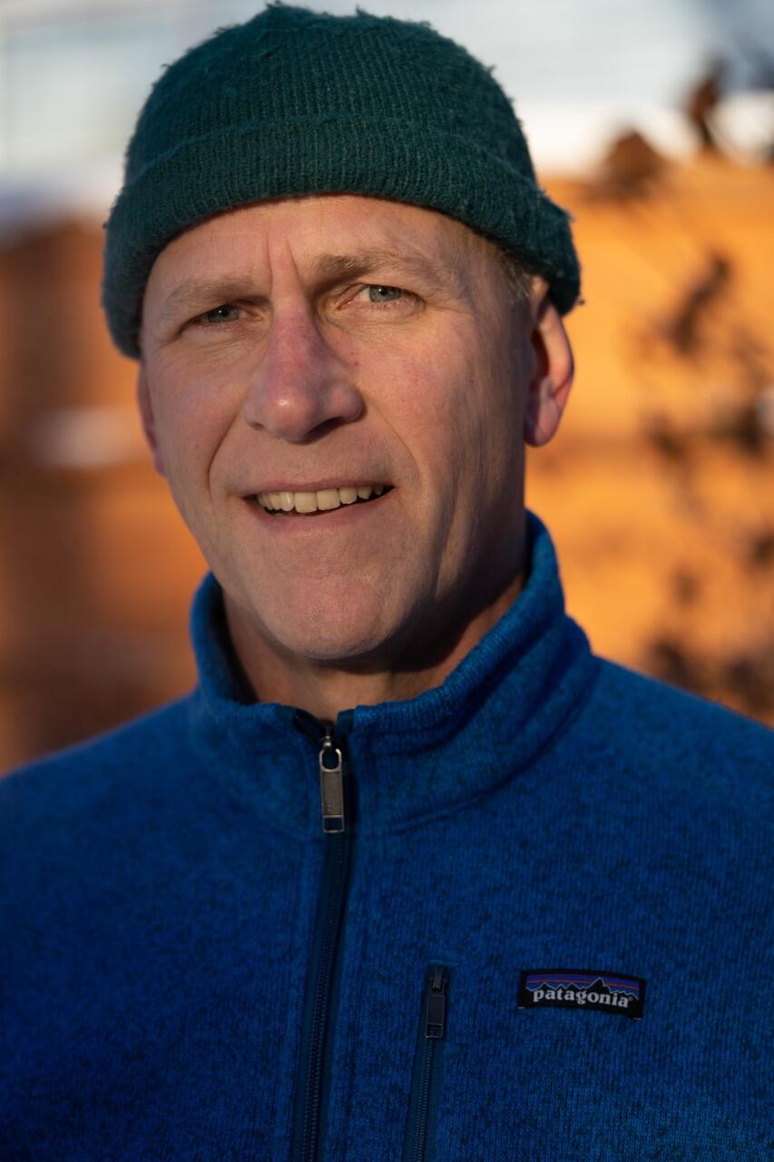 Staff profile photo of Chris Zimmerman. He is wearing a hat and polar fleece jacket.