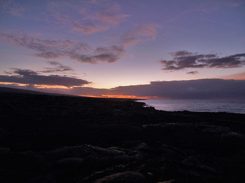 This is a photo of a soft early sunrise, looking over Lae`apuki.