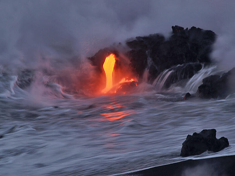 This is a photo of lava pouring into water at northeast end of Banana lava delta.