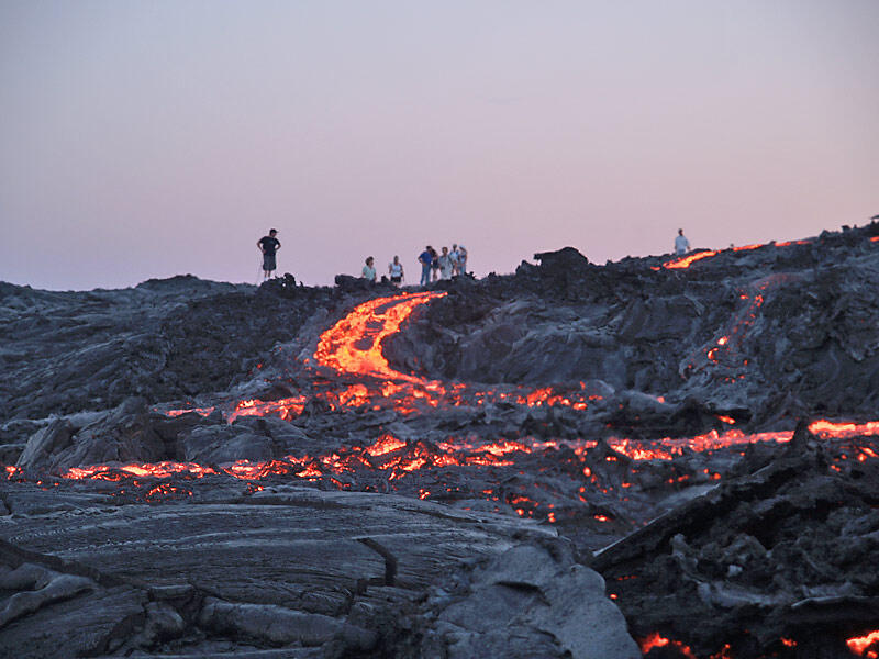 This is a photo of west branch of blue-fume breakout pouring down pre-Wilipe`a sea cliff and spreading across delta below.