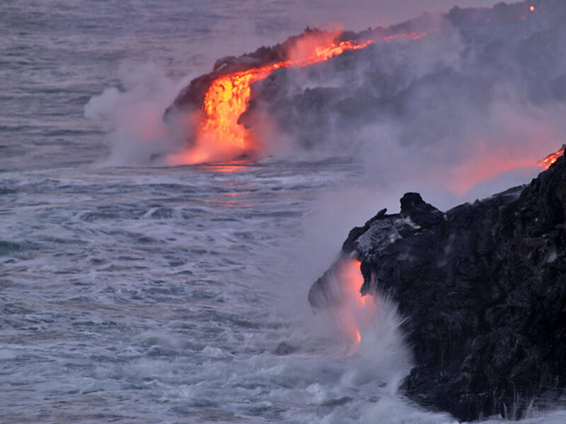 This is a photo of a dawn view of lava entering sea on eastern Banana delta.