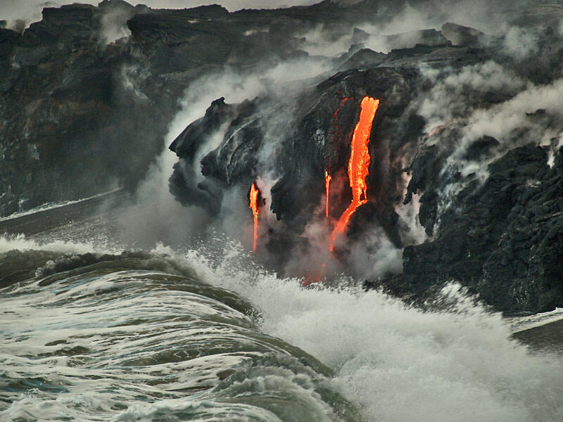 This is a photo of a wave starting to crash against the decidedly smaller main entry area.