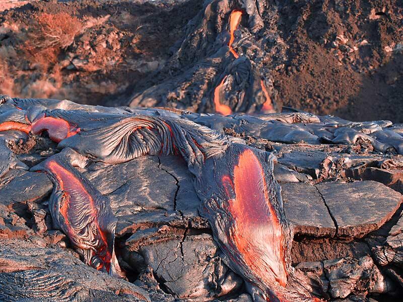 This is a photo of lava breaking out from under crust.