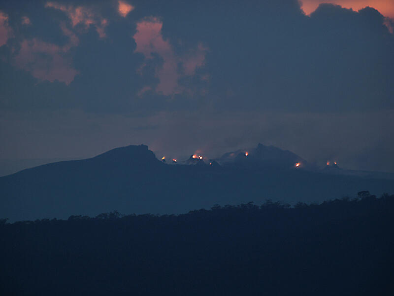 This is a photo of a postdawn view of Pu`u `O`o from top of Pu`u Huluhulu.