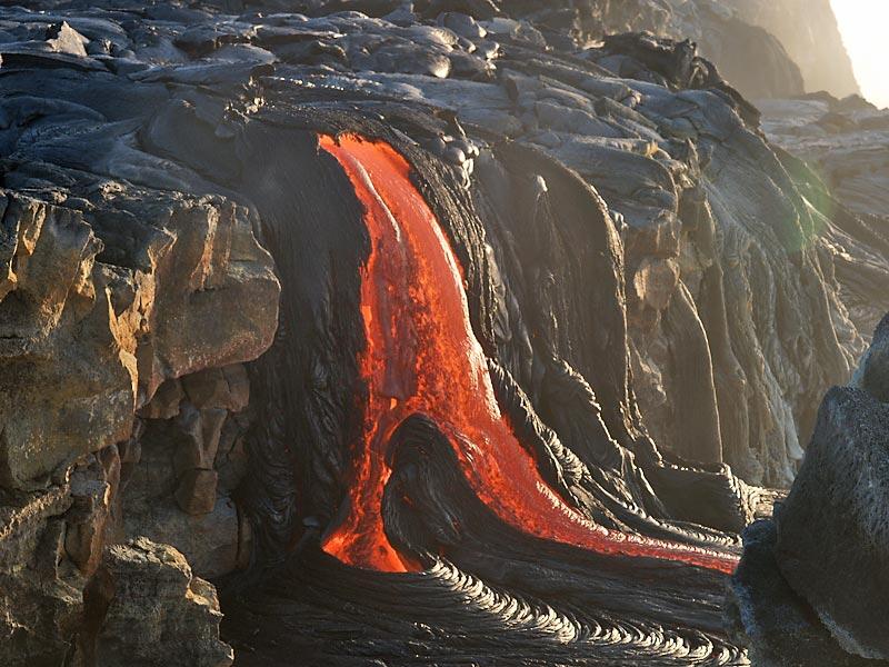 This is a photo of lava pouring onto a new lava delta.