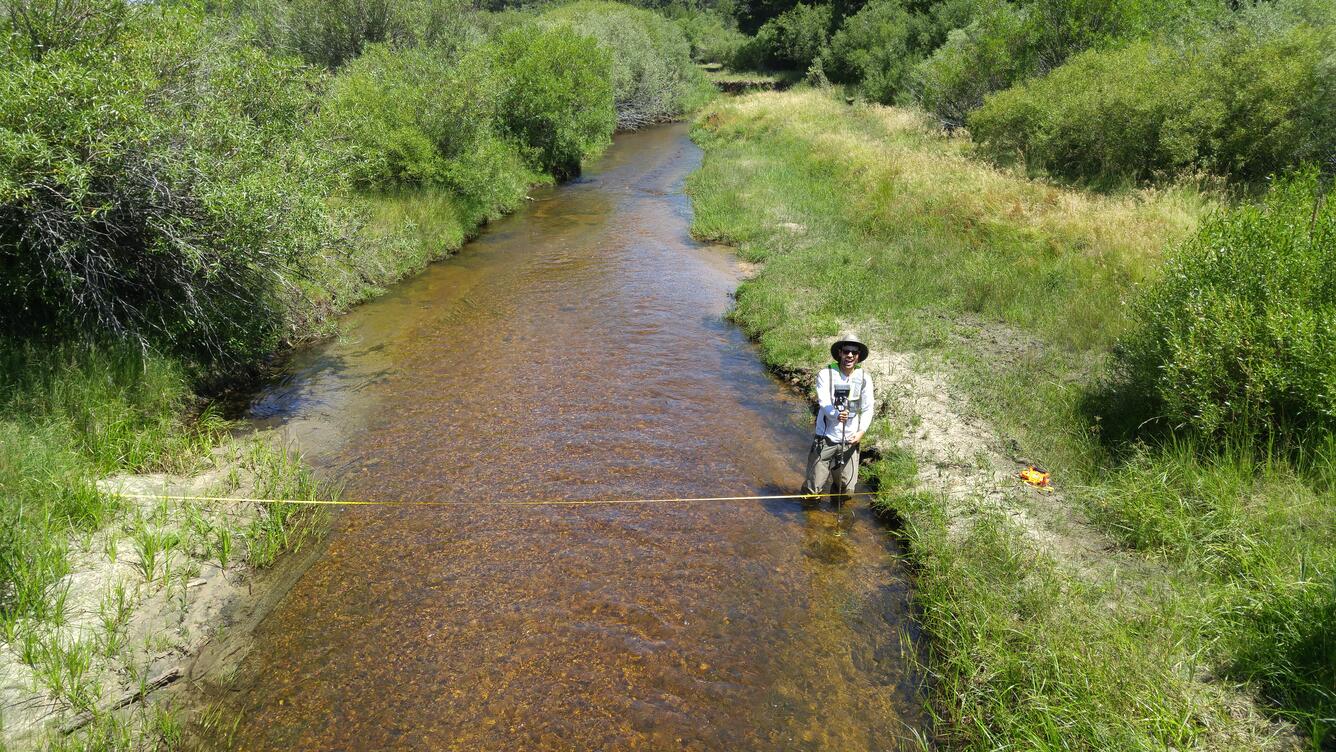 USGS scientist measuring streamflow at Trout Creek near Tahoe Valley, CA