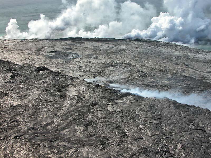 This is a photo of an aerial view looking southeastward across East Lae`apuki lava delta.