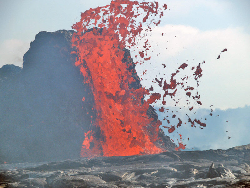 This is a photo of lava gushing joined by spatter.