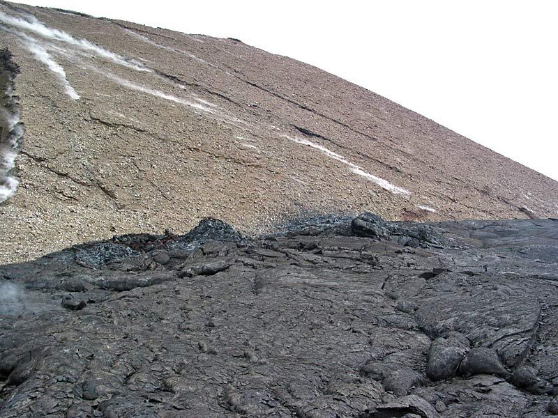 This is a photo of two tiny vents, indicated by spatter strewn on flank of Pu`u `O`o.
