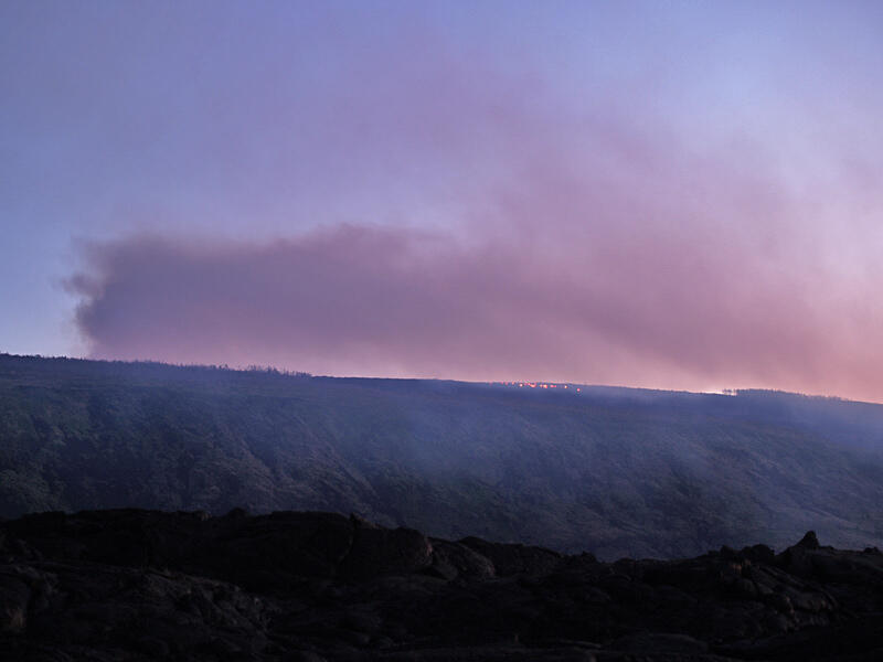 This is a photo of a plume of volcanic gas rising above Pu`u `O`o.