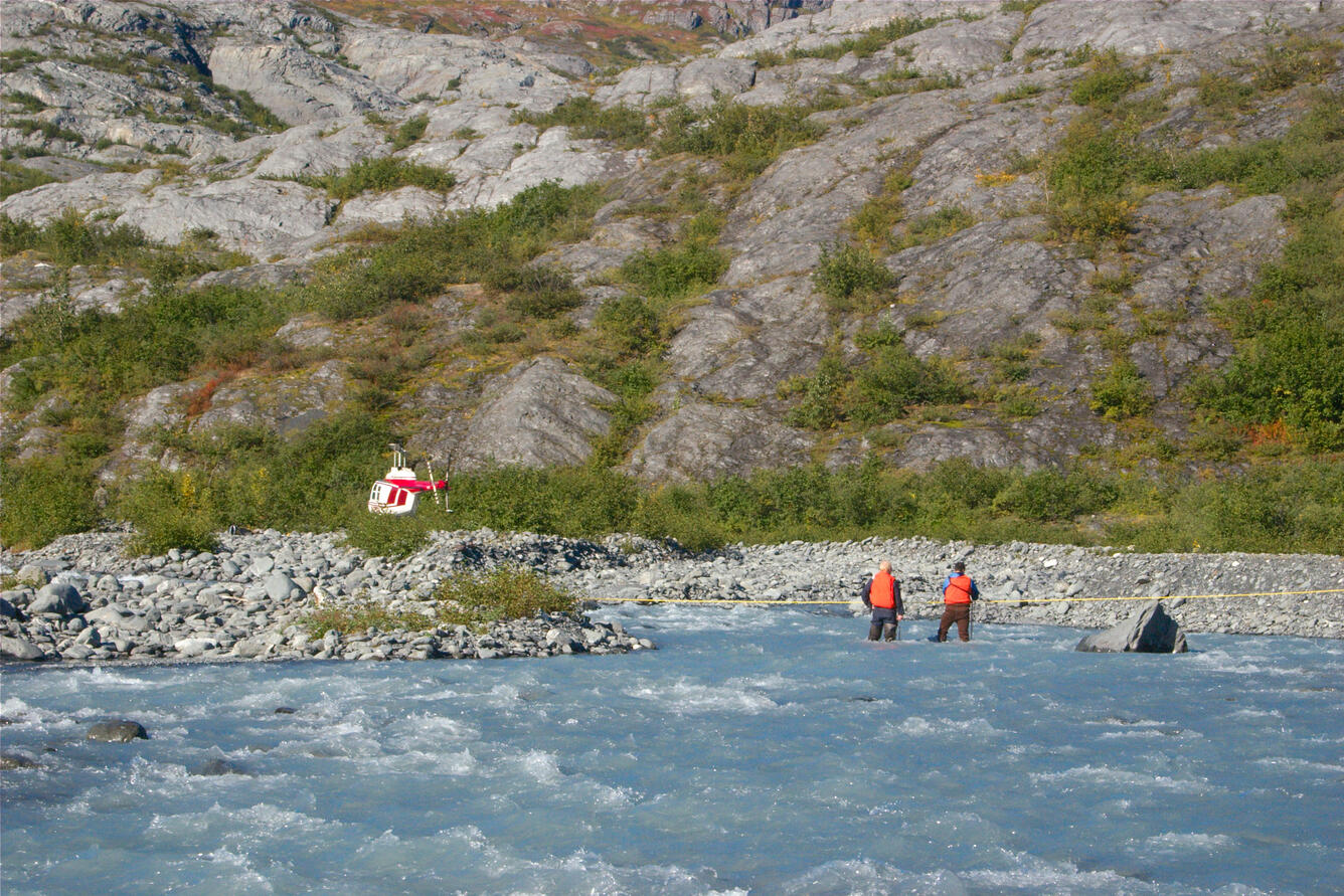 USGS employees measure discharge at USGS gage 15236900 Wolverine Creek near Lawning, Alaska