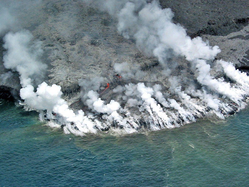 This is a photo of a new Kamoamoa ocean entry largely shrouded in laze and fume.