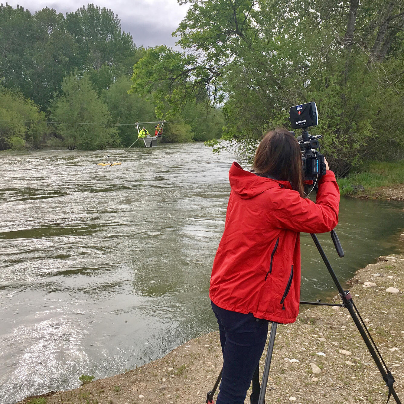 Television reporter filming USGS hydrologic technicians at 13206000