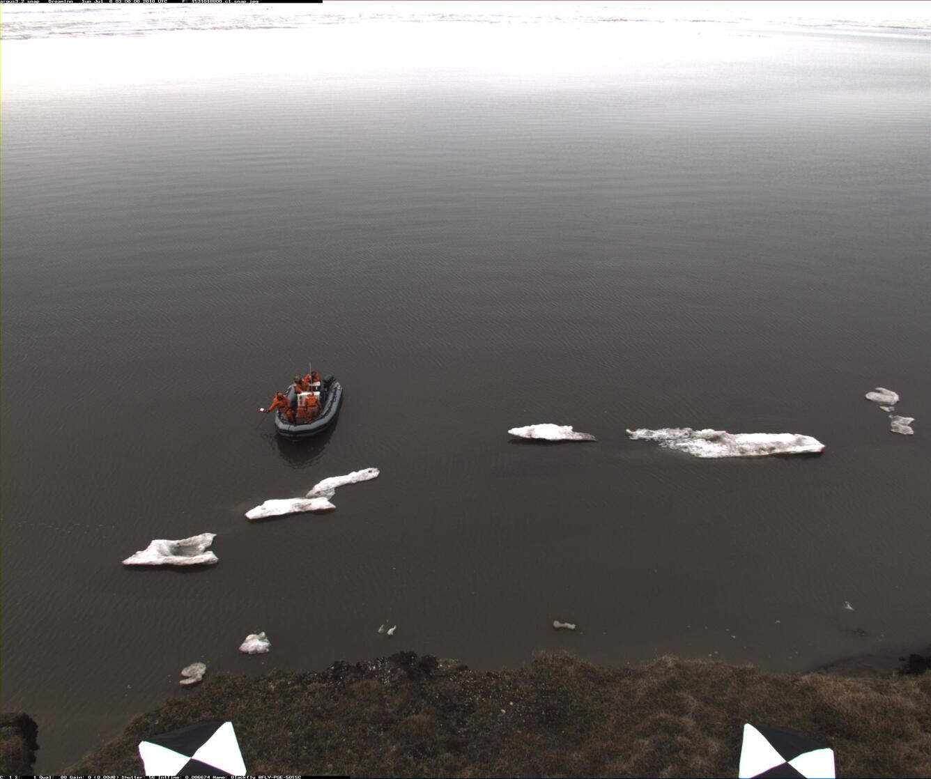 boat with personnel installing a wave guage