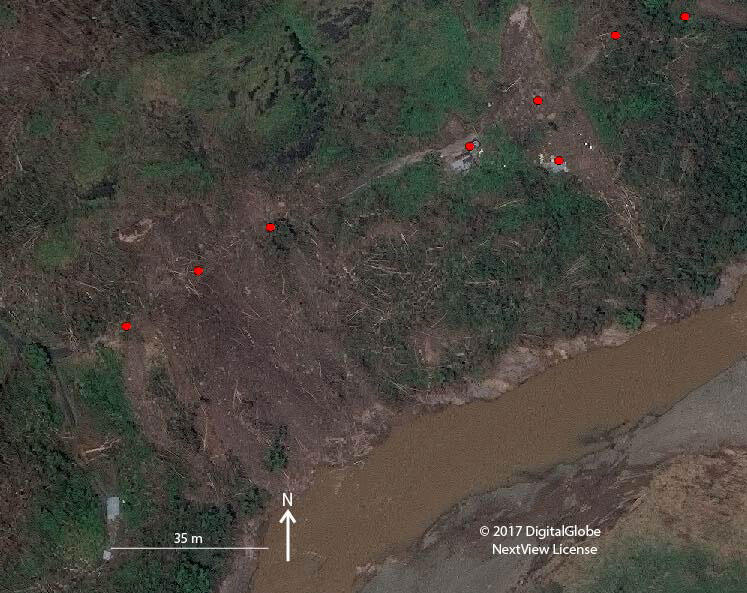 Excerpt of satellite image showing landslide impacts to Highway PR-109 and buildings in the Anasco Municipality.