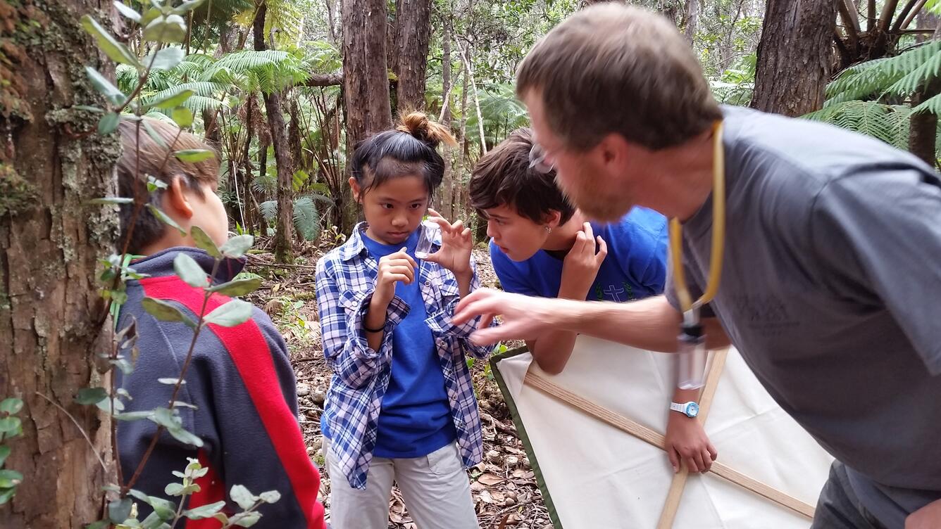 PIERC cooperator Bob Peck teaches children about invertebrates at Hawaii Volcanoes National Park