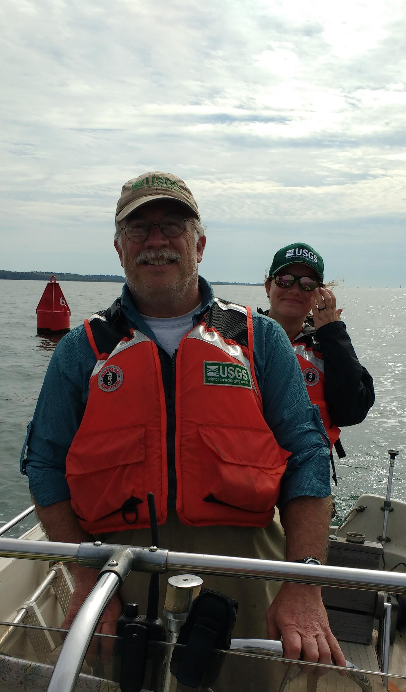 Photo of Hydrologist, Dave Armstrong, driving a boat