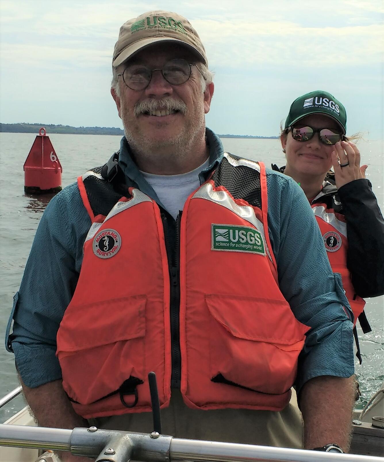 USGS Hydrologist Dave Armstrong, driving a boat on the Sakonnet River, RI