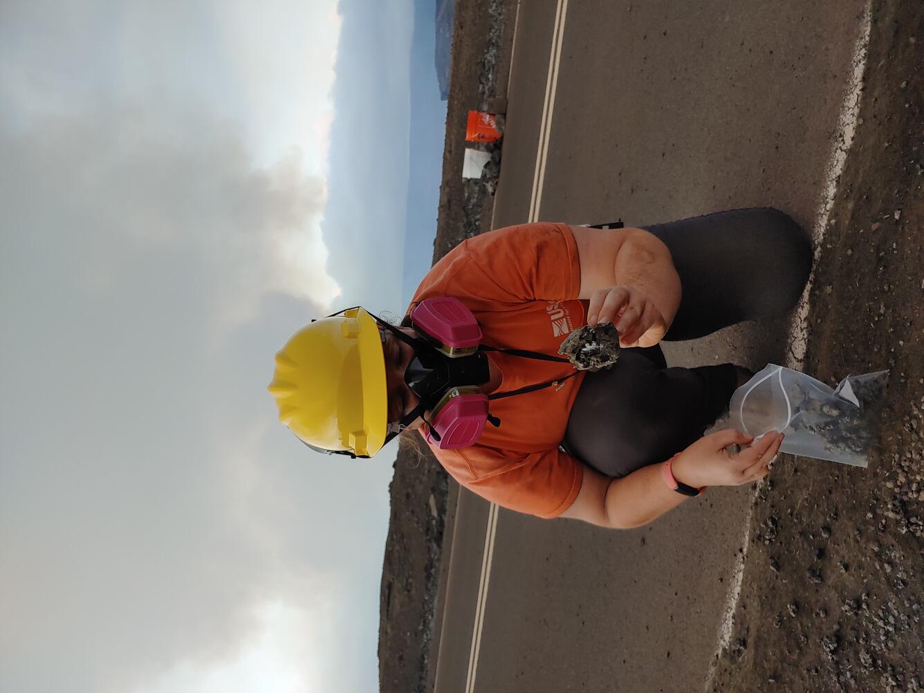 Color photograph of scientist collecting sample