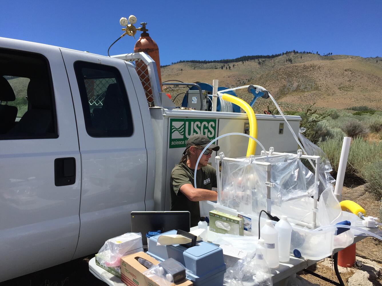 USGS scientist collecting water-quality samples from a well in Nevada