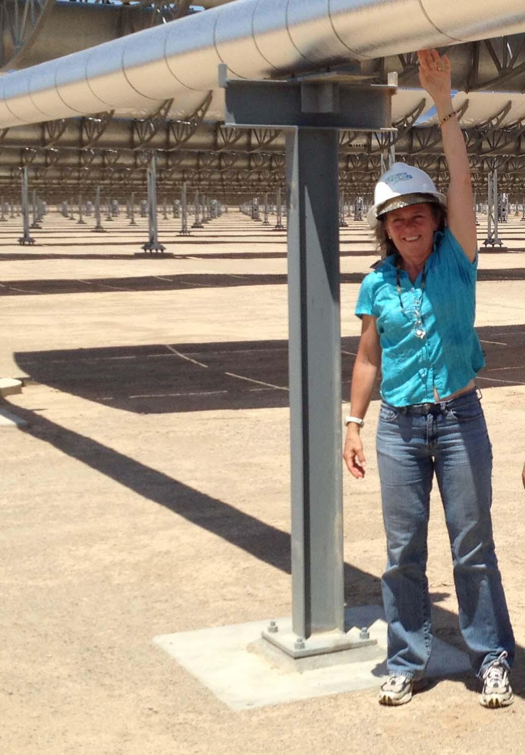 woman standing under solar trough