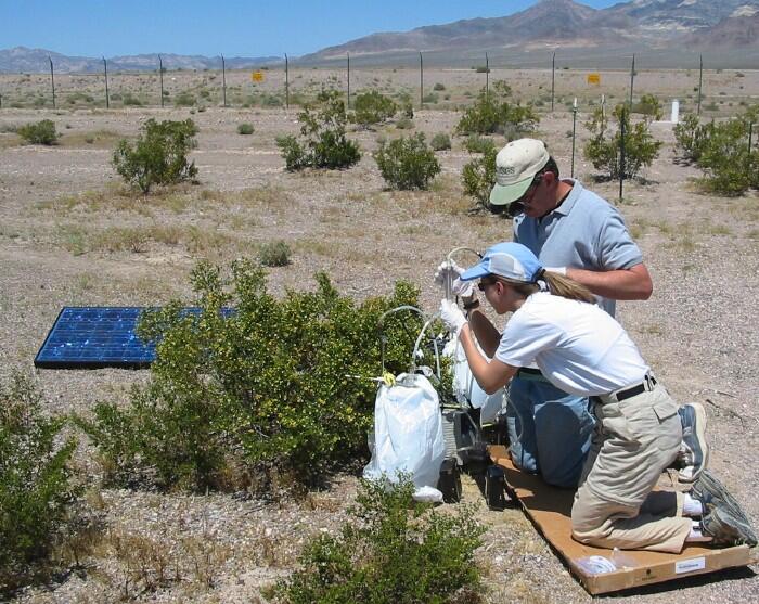 USGS scientists collecting gas samples from the unsaturated zone. Subsurface gases are drawn through a small glass tube filled w